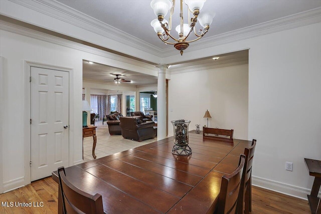 dining space with hardwood / wood-style floors, crown molding, ceiling fan with notable chandelier, and decorative columns