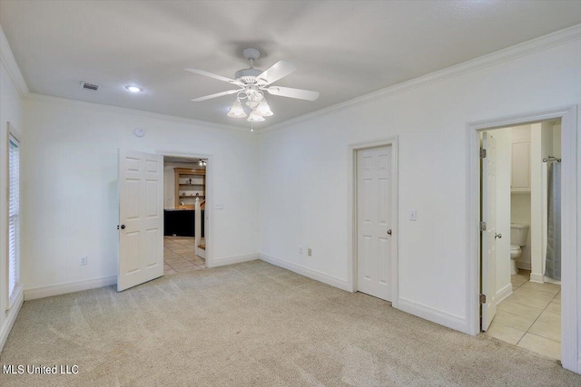 unfurnished bedroom with crown molding, light colored carpet, and ceiling fan