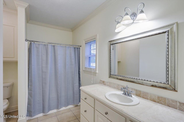 bathroom featuring tile patterned floors, toilet, a shower with curtain, ornamental molding, and vanity