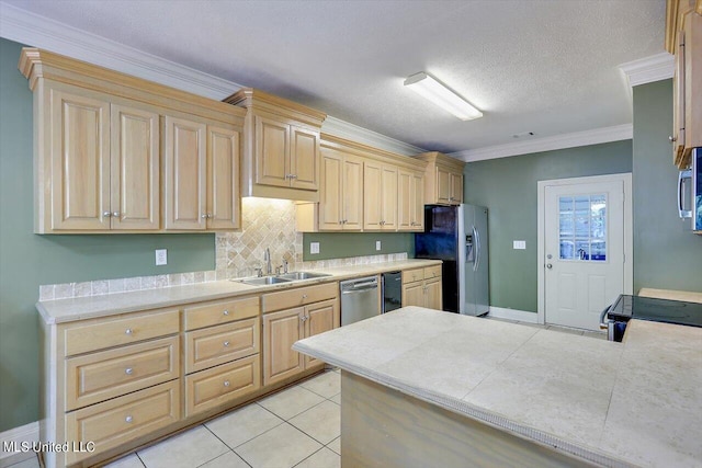 kitchen with stainless steel appliances, ornamental molding, sink, light tile patterned flooring, and light brown cabinetry