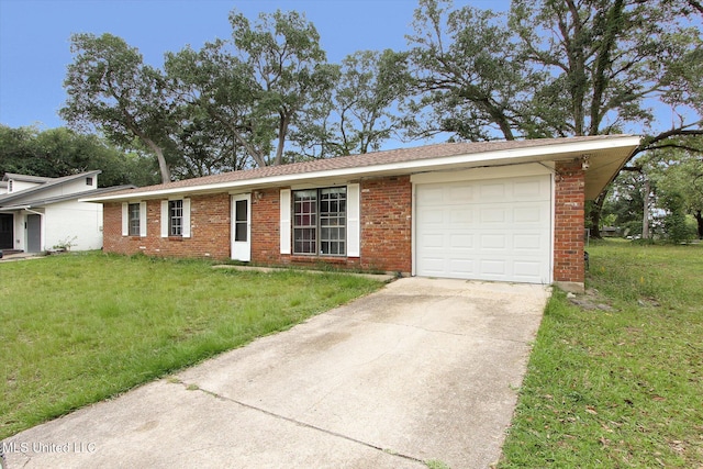 15820 Big Ridge Rd, Biloxi, MS 39532 - single story home featuring driveway, a front lawn, an attached garage, and brick siding