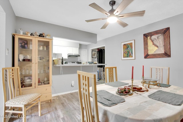 15820 Big Ridge Rd, Biloxi, MS 39532 - dining area featuring light wood-style flooring and ceiling fan