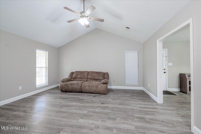 6967 Green Way Cv, Olive Branch, MS 38654 - living area featuring ceiling fan, lofted ceiling, and wood finished floors