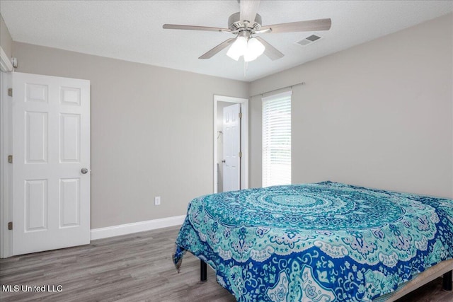 6967 Green Way Cv, Olive Branch, MS 38654 - bedroom featuring wood finished floors and ceiling fan