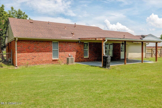 6967 Green Way Cv, Olive Branch, MS 38654 - rear view of house with a patio, brick siding, and roof with shingles