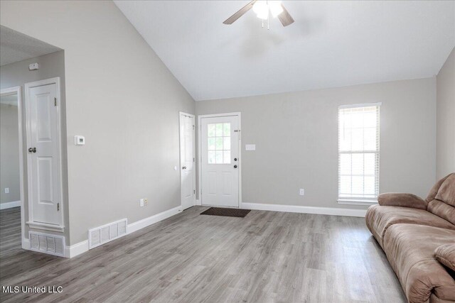 6967 Green Way Cv, Olive Branch, MS 38654 - living room with light wood-style flooring, a ceiling fan, and vaulted ceiling