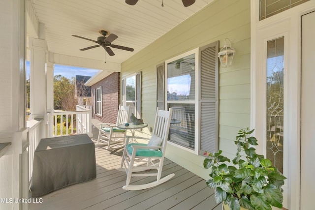 wooden deck featuring ceiling fan and a porch