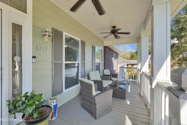 deck with covered porch and ceiling fan