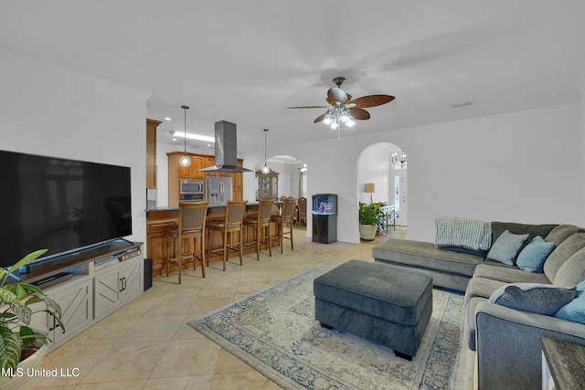 tiled living room featuring ceiling fan