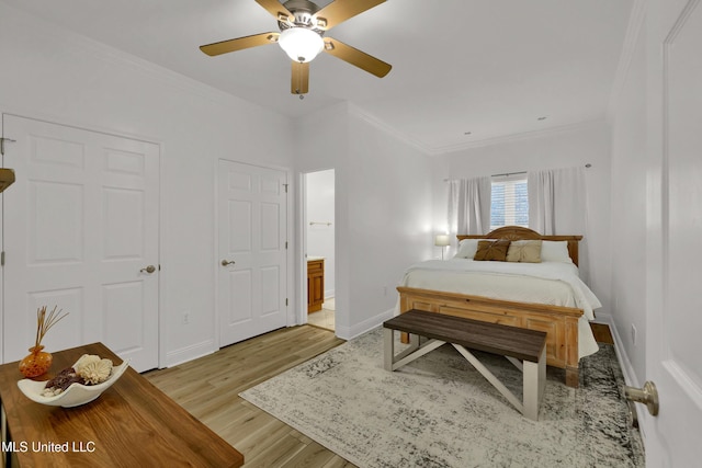 bedroom with ceiling fan, light hardwood / wood-style floors, and ornamental molding