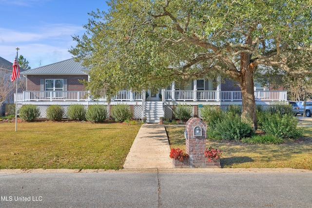 obstructed view of property with covered porch and a front lawn