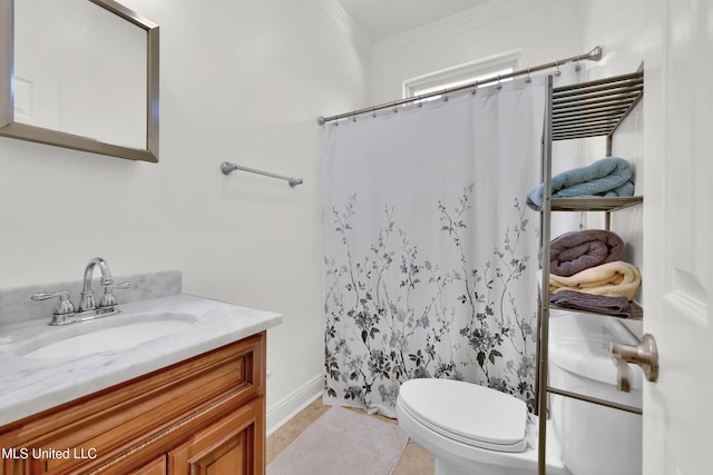 bathroom featuring tile patterned flooring, vanity, toilet, and crown molding