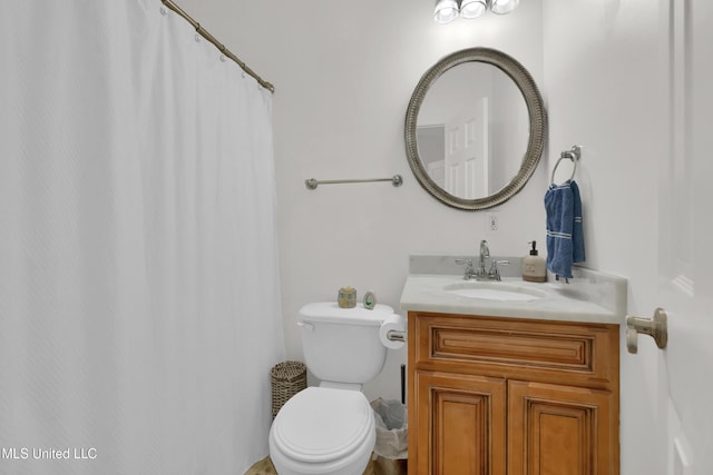 bathroom featuring vanity and toilet