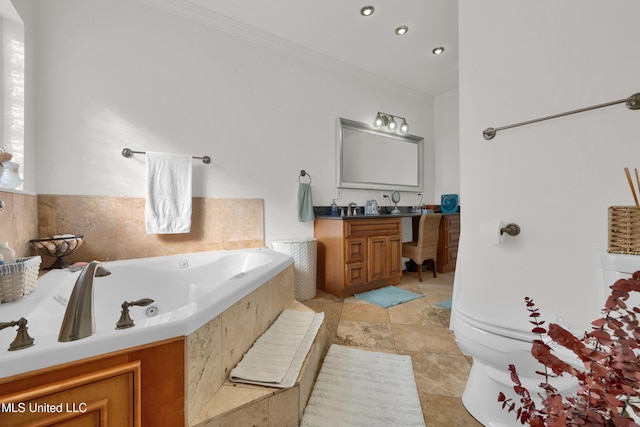 bathroom with vanity, ornamental molding, and a washtub