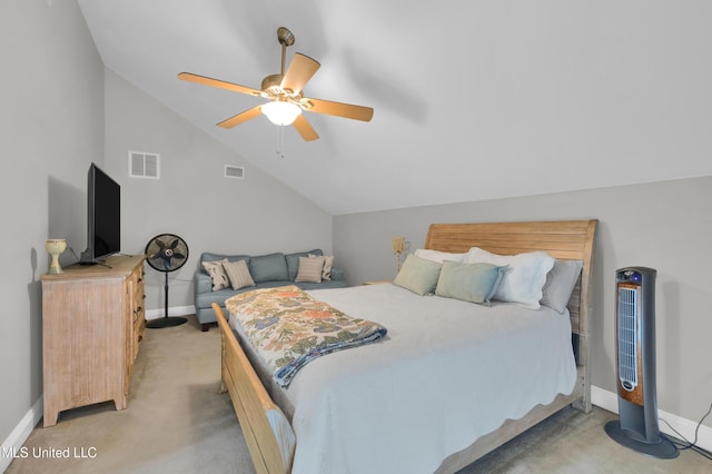 bedroom featuring ceiling fan, light colored carpet, and vaulted ceiling