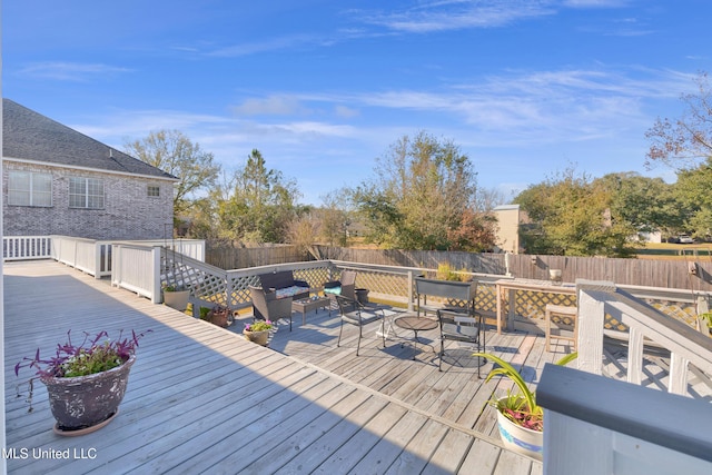 wooden deck featuring an outdoor hangout area