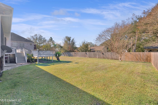 view of yard with a wooden deck