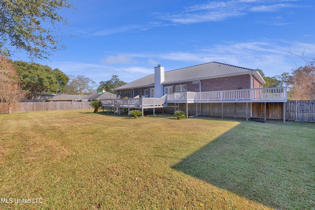 view of yard with a wooden deck