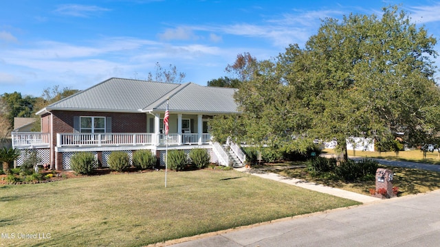 view of front facade featuring covered porch and a front yard