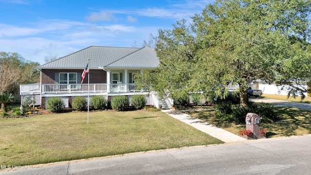 view of front of home with a porch and a front yard