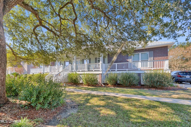 view of front of home featuring a porch and a front yard