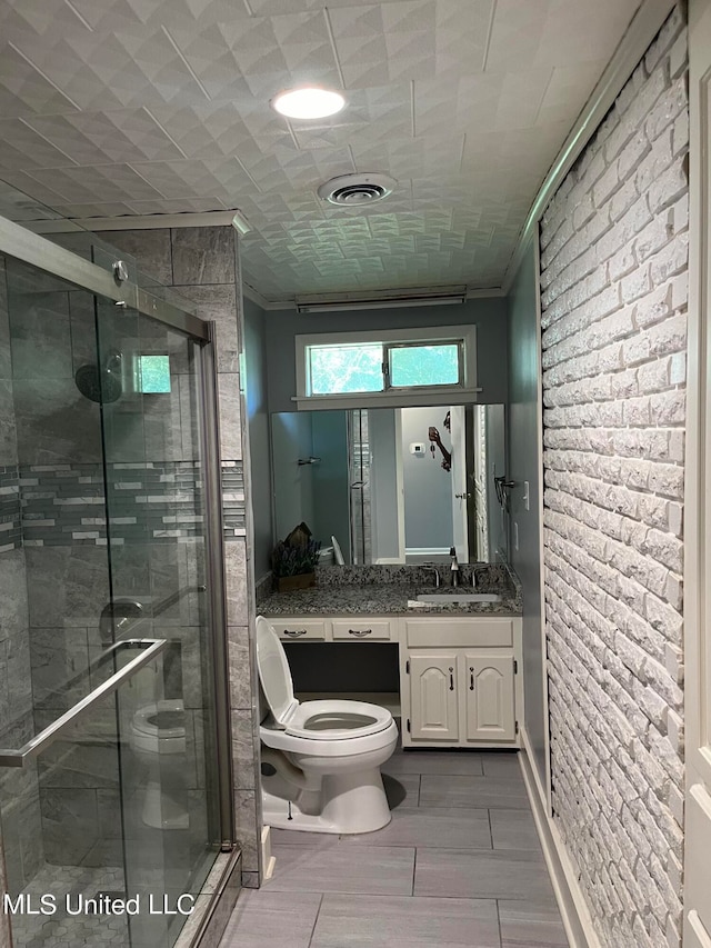 bathroom with vanity, crown molding, walk in shower, and toilet