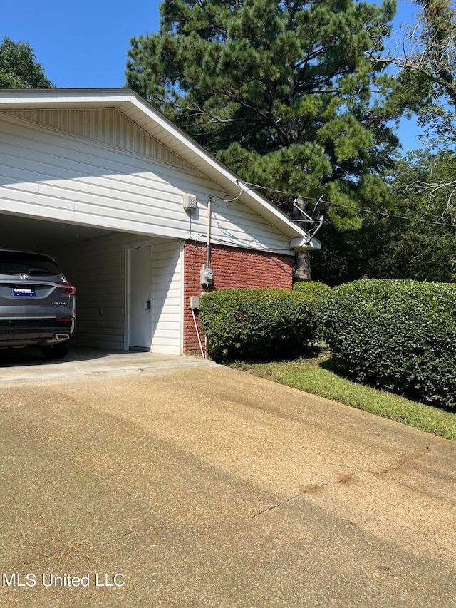 view of property exterior with a carport