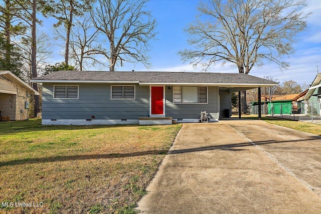 view of front of property with driveway, an attached carport, crawl space, fence, and a front yard