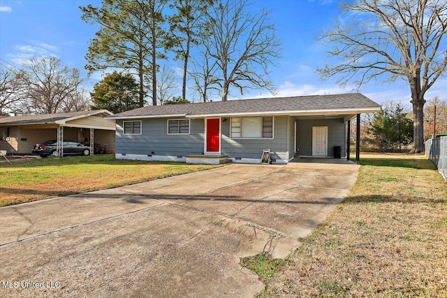 ranch-style house featuring entry steps, an attached carport, driveway, crawl space, and a front lawn