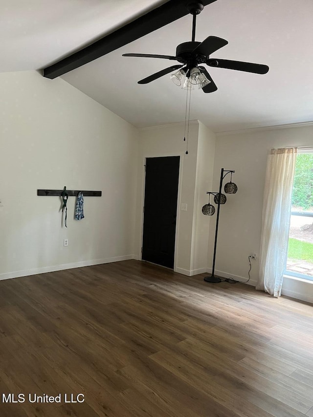 empty room with lofted ceiling with beams, a ceiling fan, baseboards, and wood finished floors