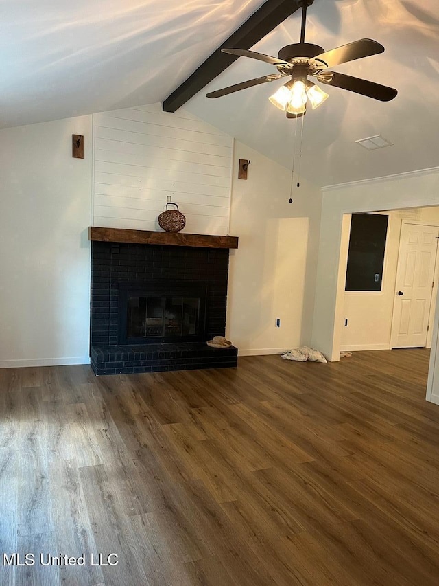 unfurnished living room featuring a fireplace, lofted ceiling with beams, baseboards, and wood finished floors