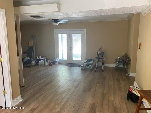 misc room with french doors, a textured ceiling, wood-type flooring, and ceiling fan