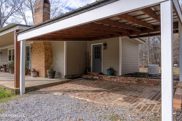 exterior space featuring a carport