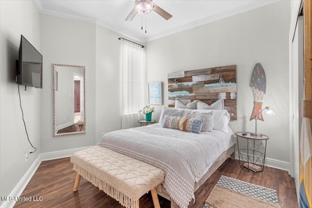 bedroom with ornamental molding, ceiling fan, and dark hardwood / wood-style flooring