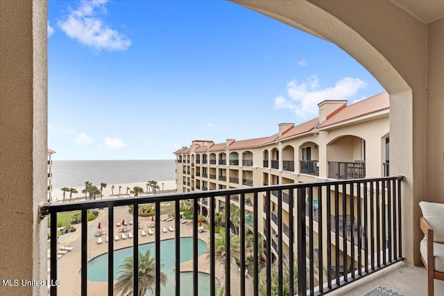 balcony featuring a water view