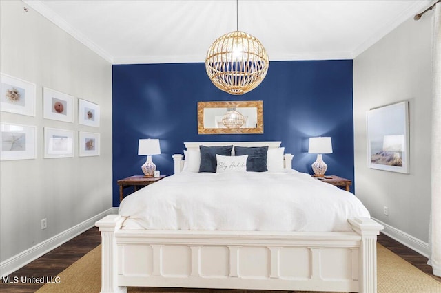 bedroom with crown molding, a notable chandelier, and dark hardwood / wood-style floors