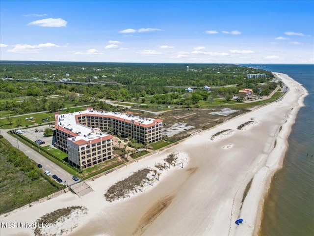 bird's eye view featuring a water view and a beach view