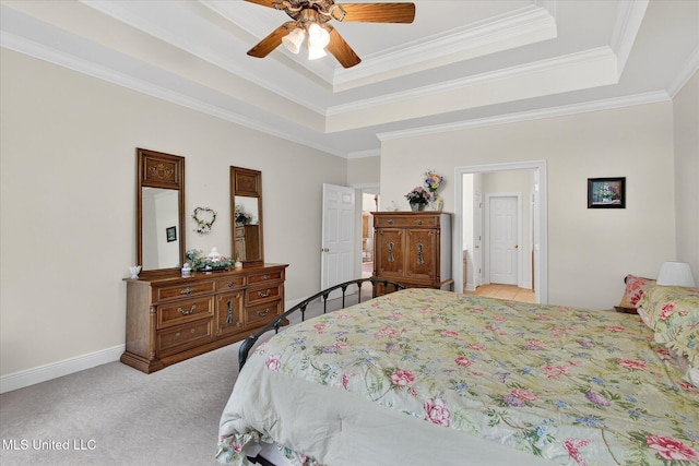7622 Fairway Dr, Diamondhead, MS 39525 - carpeted bedroom with a tray ceiling, crown molding, and ceiling fan