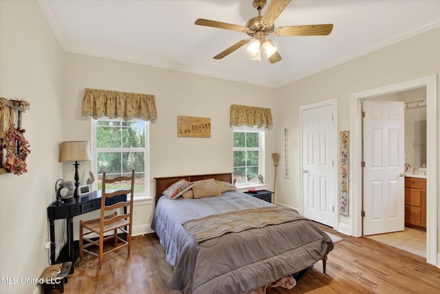 7622 Fairway Dr, Diamondhead, MS 39525 - bedroom with light wood-style floors, crown molding, and ceiling fan