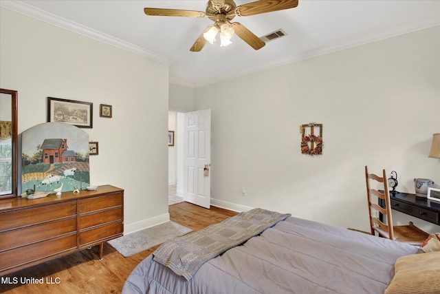 7622 Fairway Dr, Diamondhead, MS 39525 - bedroom with wood finished floors, ornamental molding, and a ceiling fan