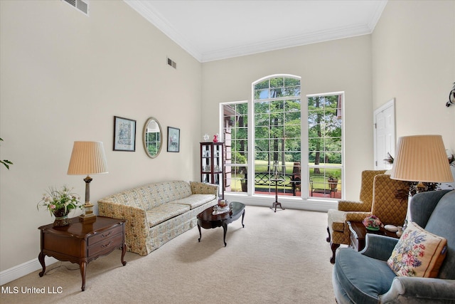 7622 Fairway Dr, Diamondhead, MS 39525 - living room featuring carpet floors, crown molding, and a high ceiling