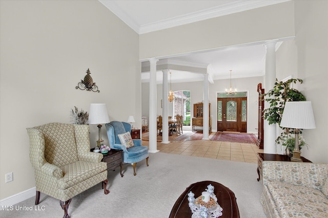7622 Fairway Dr, Diamondhead, MS 39525 - tiled entryway with decorative columns, a chandelier, carpet, and crown molding