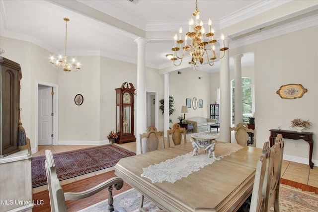 7622 Fairway Dr, Diamondhead, MS 39525 - dining area featuring a chandelier, light tile patterned floors, decorative columns, and crown molding