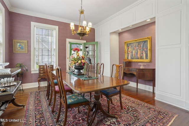 1616 Poplar Blvd, Jackson, MS 39202 - dining space with ornamental molding, a chandelier, dark wood-style flooring, and baseboards