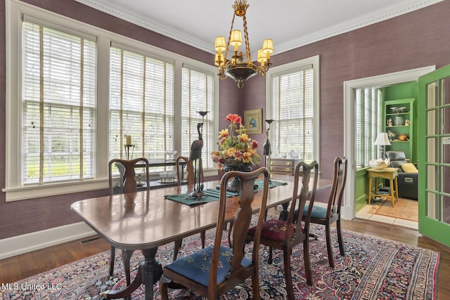 1616 Poplar Blvd, Jackson, MS 39202 - dining area featuring a chandelier, plenty of natural light, hardwood / wood-style flooring, and ornamental molding