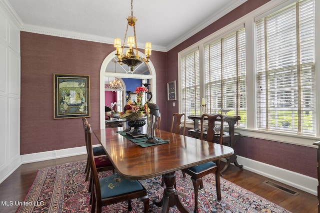 1616 Poplar Blvd, Jackson, MS 39202 - dining space featuring a chandelier, dark wood finished floors, baseboards, and ornamental molding