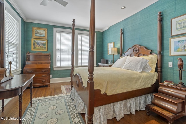 1616 Poplar Blvd, Jackson, MS 39202 - bedroom with multiple windows, wood finished floors, baseboards, wallpapered walls, and crown molding