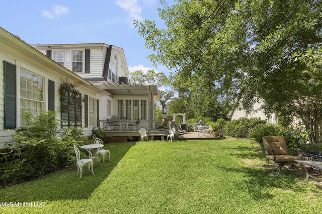 1616 Poplar Blvd, Jackson, MS 39202 - view of grassy yard featuring a wooden deck