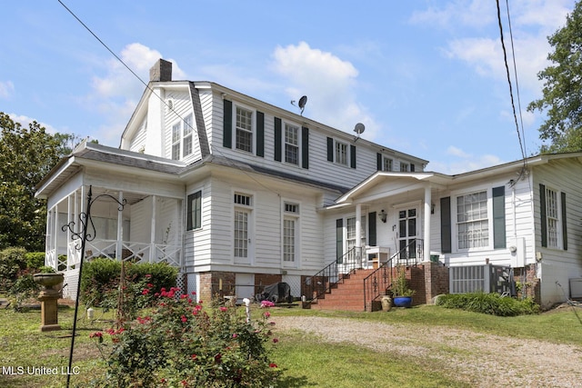 1616 Poplar Blvd, Jackson, MS 39202 - view of front of house with covered porch, a chimney, and a front yard