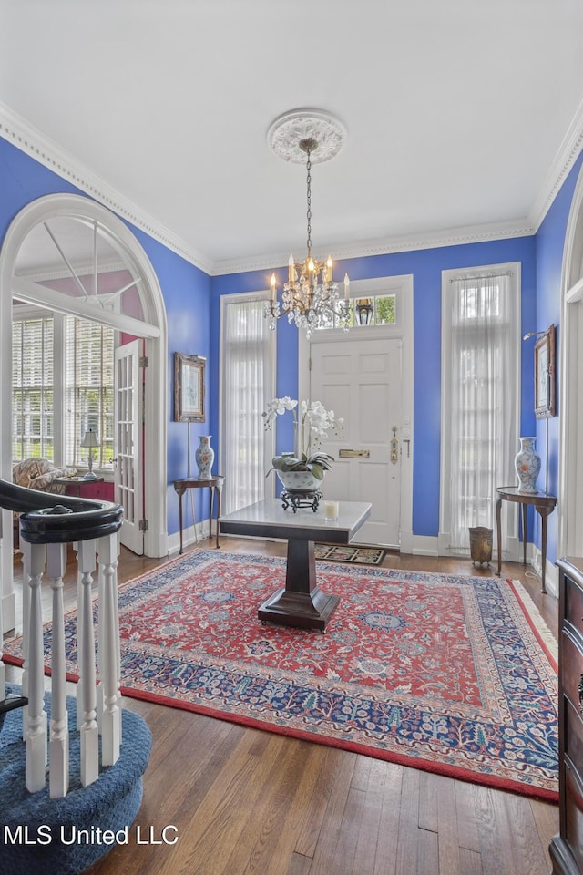 1616 Poplar Blvd, Jackson, MS 39202 - entrance foyer with a chandelier, healthy amount of natural light, wood finished floors, and ornamental molding